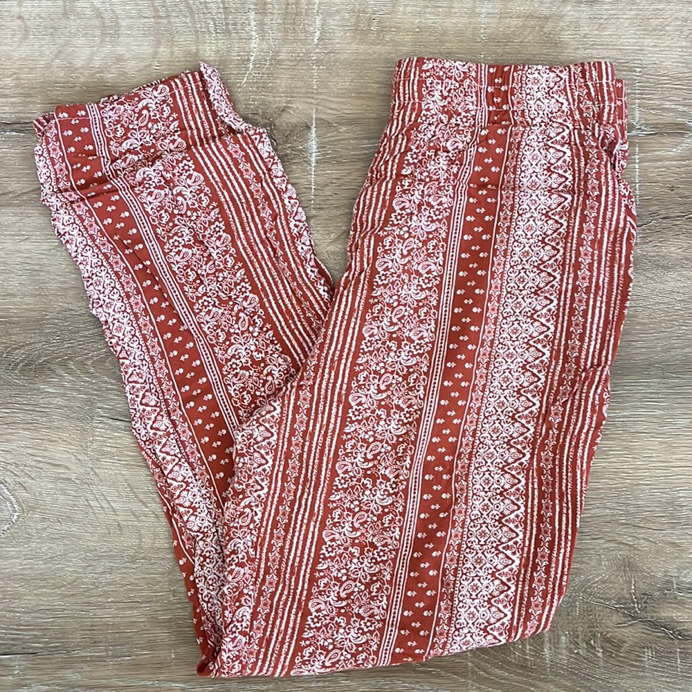 orange printed pants with pockets